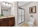 Bathroom features a vanity with solid surface countertops and a glass-enclosed shower at 120 Chastain Nw Rd # 608, Kennesaw, GA 30144