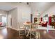 Open dining area with hardwood floors leading to the living room and bedroom at 120 Chastain Nw Rd # 608, Kennesaw, GA 30144