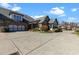 Beautiful home exterior with a large driveway, three-car garage, and attractive landscaping at 120 Chastain Nw Rd # 608, Kennesaw, GA 30144