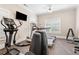 Well equipped fitness center with modern exercise machines and ample natural light, promoting a healthy lifestyle at 120 Chastain Nw Rd # 608, Kennesaw, GA 30144
