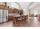 Modern kitchen area with stainless steel appliances and generous island seating in a community clubhouse at 120 Chastain Nw Rd # 608, Kennesaw, GA 30144