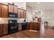 Spacious kitchen features granite countertops and stainless steel appliances at 120 Chastain Nw Rd # 608, Kennesaw, GA 30144