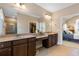 Elegant main bathroom with a double sink vanity, tiled floors and a door to the bedroom at 120 Chastain Nw Rd # 608, Kennesaw, GA 30144