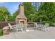 Patio with outdoor fireplace and comfortable seating at 120 Chastain Nw Rd # 608, Kennesaw, GA 30144
