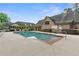 Community pool featuring lounge seating and a shallow end for relaxation at 120 Chastain Nw Rd # 608, Kennesaw, GA 30144