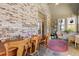 Sunroom offers exposed brick, outdoor views, and tile flooring at 120 Chastain Nw Rd # 608, Kennesaw, GA 30144