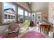 Sunroom with natural light, multiple windows, and tile flooring at 120 Chastain Nw Rd # 608, Kennesaw, GA 30144