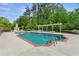 Refreshing swimming pool with lounge chairs and a cozy outdoor fireplace, perfect for relaxation and socializing at 120 Chastain Nw Rd # 608, Kennesaw, GA 30144