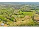 Expansive aerial view of the property, showcasing lush greenery and scenic landscape at 1288 Reavesville Rd, Bowdon, GA 30108