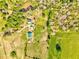 Expansive property featuring a blend of lush greenery, open fields, and cozy cabin-style buildings at 1288 Reavesville Rd, Bowdon, GA 30108