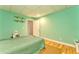 Cozy basement featuring wood flooring and a neatly made bed at 1288 Reavesville Rd, Bowdon, GA 30108