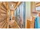 Hallway bathroom featuring linoleum flooring, wood paneled walls, and a shower behind a curtain at 1288 Reavesville Rd, Bowdon, GA 30108