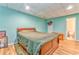 Bedroom with wood floors and an ensuite bathroom at 1288 Reavesville Rd, Bowdon, GA 30108