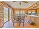 Bright dining area featuring wood floors, ample natural light, and an adjacent bar at 1288 Reavesville Rd, Bowdon, GA 30108