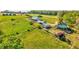 Sprawling green property featuring farm buildings and open pasture land at 1288 Reavesville Rd, Bowdon, GA 30108