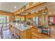 Rustic kitchen boasts stainless steel appliances, wood counters, and plenty of cabinet space at 1288 Reavesville Rd, Bowdon, GA 30108