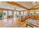 Open-concept kitchen features a large island, tile flooring, wooden cabinetry and natural light from the windows at 1288 Reavesville Rd, Bowdon, GA 30108