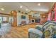 Cozy living room with vaulted ceilings, brick fireplace, and rustic wood accents at 1288 Reavesville Rd, Bowdon, GA 30108