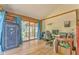 Bright living room with hardwood floors, desk space, and sliding glass doors to the deck at 1288 Reavesville Rd, Bowdon, GA 30108
