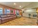 Spacious living room with hardwood floors, vaulted ceilings, and multiple windows for natural light at 1288 Reavesville Rd, Bowdon, GA 30108