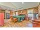 Warm bedroom featuring hardwood floors, log walls, and neutral accents; a relaxing retreat at 1288 Reavesville Rd, Bowdon, GA 30108
