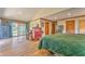 Spacious main bedroom with hardwood floors, large windows, two gun safes and an office area at 1288 Reavesville Rd, Bowdon, GA 30108