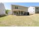 A spacious backyard with a covered patio at 1815 Wellston Dr, Lawrenceville, GA 30043