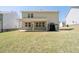 A spacious backyard with a covered patio at 1815 Wellston Dr, Lawrenceville, GA 30043