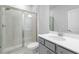 Bathroom with large walk-in shower, toilet, and single sink vanity with white countertop at 1815 Wellston Dr, Lawrenceville, GA 30043