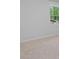 Bright bedroom featuring plush carpet and a large window overlooking the neighborhood at 1815 Wellston Dr, Lawrenceville, GA 30043