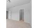 A spacious bedroom with neutral carpet, walk-in closet and neutral walls at 1815 Wellston Dr, Lawrenceville, GA 30043