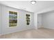 Bright entryway with neutral walls, hardwood floors, and natural light flooding through nearby windows at 1815 Wellston Dr, Lawrenceville, GA 30043