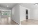 Bright entryway boasting neutral walls, hardwood floors, and views into living and dining spaces at 1815 Wellston Dr, Lawrenceville, GA 30043