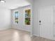 Bright entryway featuring neutral walls, hardwood floors, and natural light from nearby windows at 1815 Wellston Dr, Lawrenceville, GA 30043