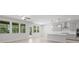 Open concept living room with light colored flooring, connected to the modern kitchen, with lots of light at 1815 Wellston Dr, Lawrenceville, GA 30043