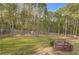 Large, private backyard with mature trees and playset, perfect for outdoor activities and Gathering fun at 209 Red Fern Ct, Canton, GA 30114