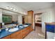 Bright bathroom with double sinks, garden tub, and wood cabinetry at 209 Red Fern Ct, Canton, GA 30114