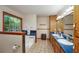 Bright bathroom featuring a large window, double sinks, and a soaking tub at 209 Red Fern Ct, Canton, GA 30114