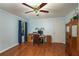 Bedroom with hardwood floors, ceiling fan, and desk at 209 Red Fern Ct, Canton, GA 30114