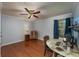 Bedroom with hardwood floors, ceiling fan, and desk at 209 Red Fern Ct, Canton, GA 30114