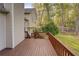 Spacious wooden deck overlooking a lush backyard with mature trees offering privacy and shade at 209 Red Fern Ct, Canton, GA 30114