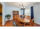 Cozy dining room features a round table with seating for six and a stylish chandelier at 209 Red Fern Ct, Canton, GA 30114