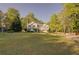 Well-maintained two-story home with a large front lawn and ample landscaping at 209 Red Fern Ct, Canton, GA 30114