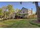 Rear exterior view showcasing a multi-story home with a fenced backyard at 209 Red Fern Ct, Canton, GA 30114
