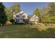 Charming two-story home with a landscaped front yard and wood deck at 209 Red Fern Ct, Canton, GA 30114