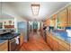 Bright kitchen featuring stainless steel appliances, wood cabinets, and hardwood floors at 209 Red Fern Ct, Canton, GA 30114