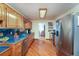 Spacious kitchen featuring stainless steel appliances, wood cabinets, and hardwood floors at 209 Red Fern Ct, Canton, GA 30114