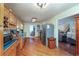 Well-lit kitchen featuring stainless steel appliances, wood cabinets, and hardwood floors at 209 Red Fern Ct, Canton, GA 30114