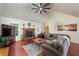 Inviting living room with a stone fireplace, vaulted ceiling, and hardwood floors at 209 Red Fern Ct, Canton, GA 30114