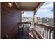 Charming balcony with seating, offering an outdoor living space with neighborhood views at 261 Highland Village Ln, Woodstock, GA 30188